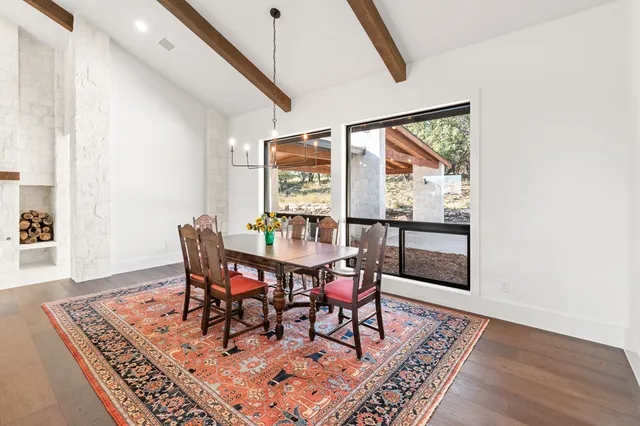 a large kitchen with kitchen island a large counter space a sink appliances and cabinets