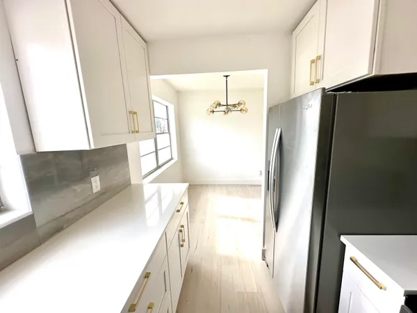 a view of kitchen and a window