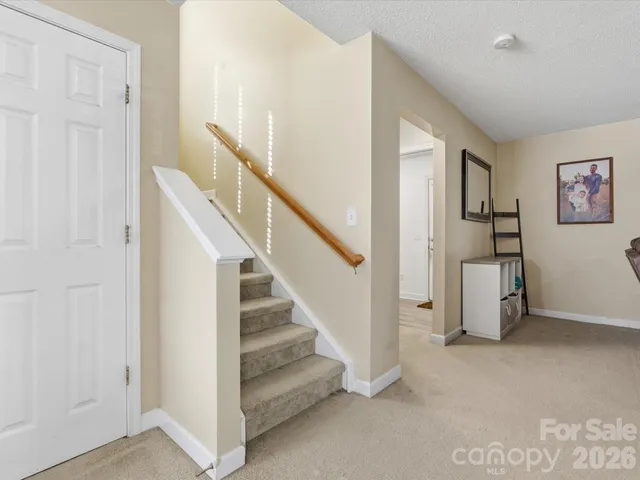a view of entryway with stairs and furniture
