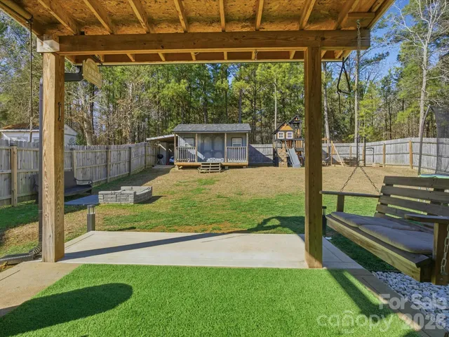a view of a backyard with plants and garden
