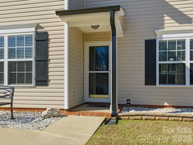 a house with swimming pool in front of it