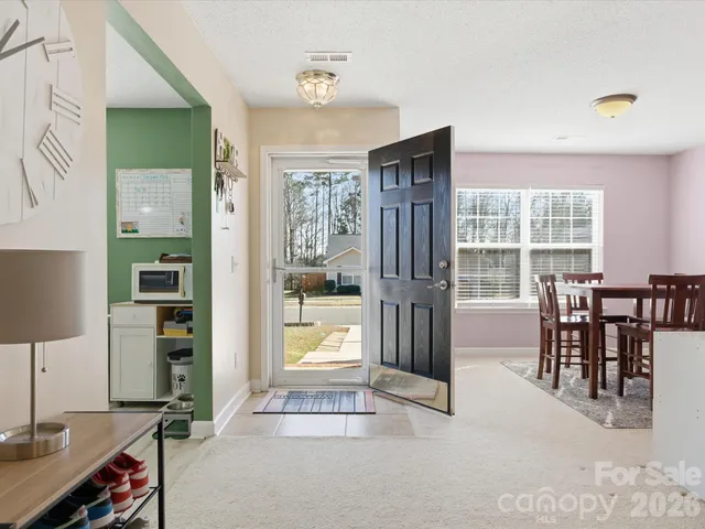 a view of a livingroom with furniture and windows