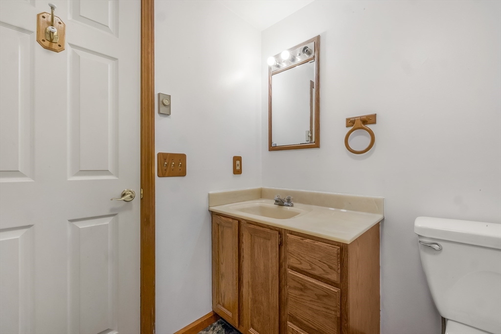 29 A Chilmark Street Worcester, MA 01604 - Photo 16 of 25 a bathroom with a sink a toilet and mirror