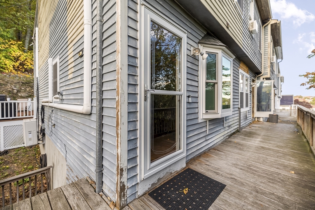 29 A Chilmark Street Worcester, MA 01604 - Photo 22 of 25 a view of a balcony with wooden floor and fence
