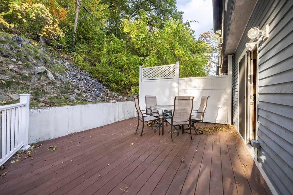 29 A Chilmark Street Worcester, MA 01604 - Photo 24 of 25 a view of a patio with table and chairs and wooden floor