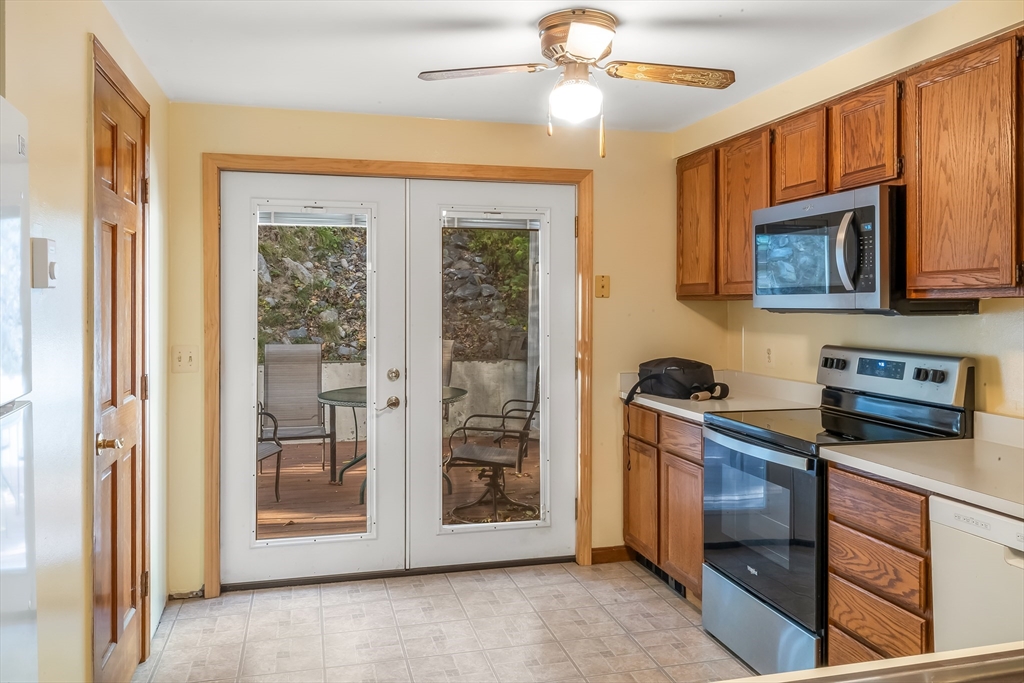 29 A Chilmark Street Worcester, MA 01604 - Photo 7 of 25 a kitchen with stainless steel appliances granite countertop a stove and a microwave
