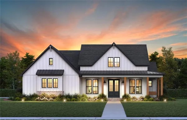 front view of a house next to a yard