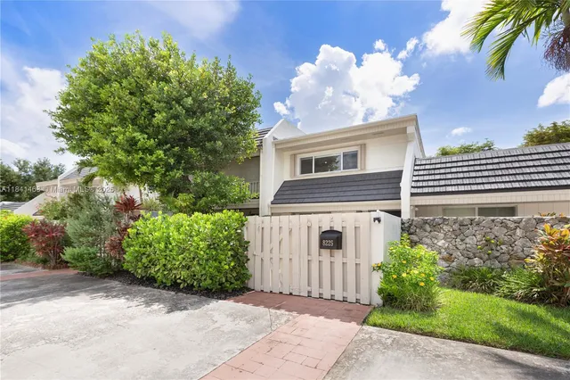 front view of a house with a garden
