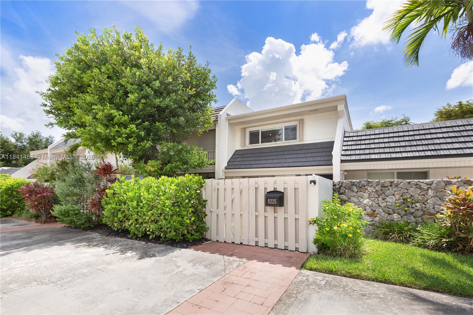 front view of a house with a garden