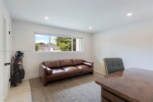 a living room with furniture and a window