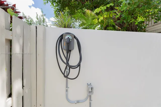 a close up of a sink with a potted plant on both side of it