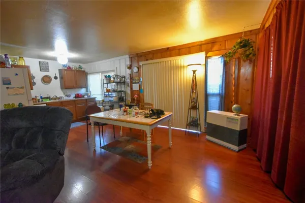 a living room with a couch and wooden floor