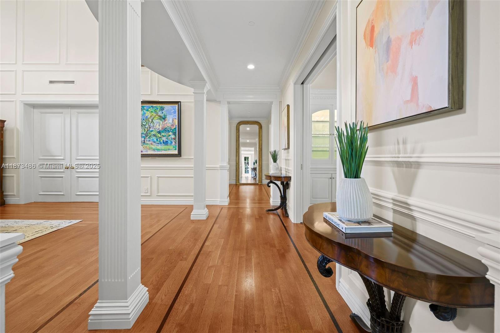 5400 Banyan Trail Coral Gables, FL 33156 - Photo 16 of 75 a dining room with wooden floor and furniture