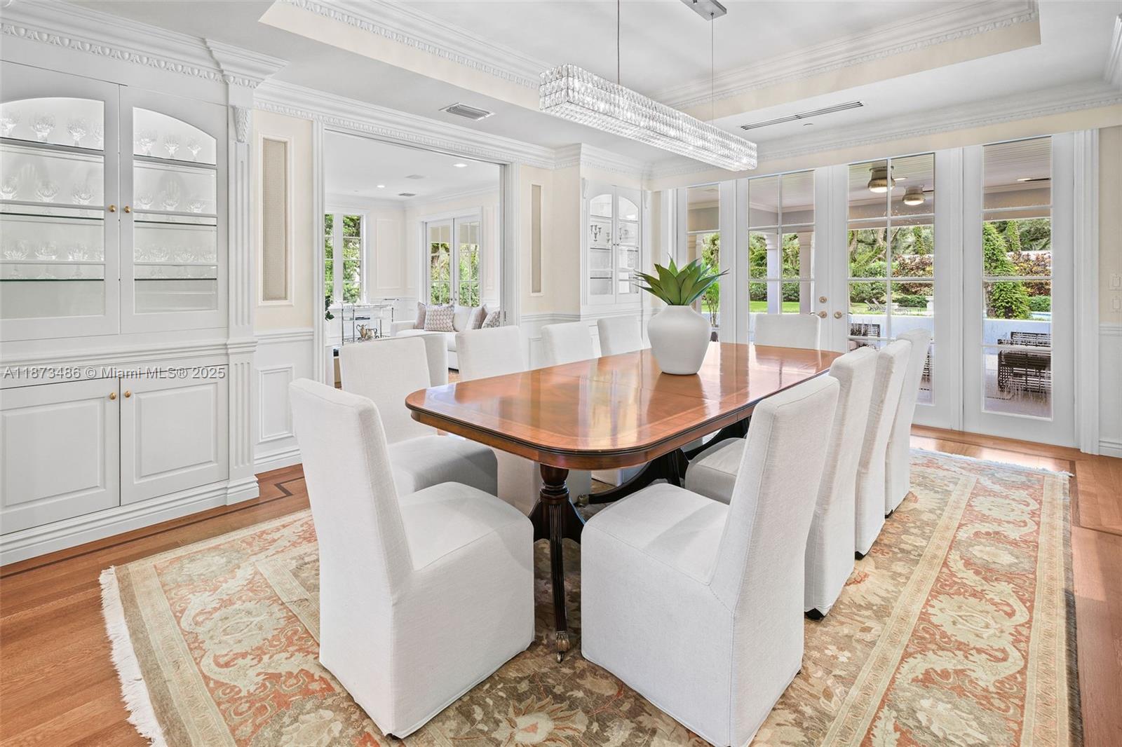 5400 Banyan Trail Coral Gables, FL 33156 - Photo 22 of 75 a dining room with furniture and wooden floor