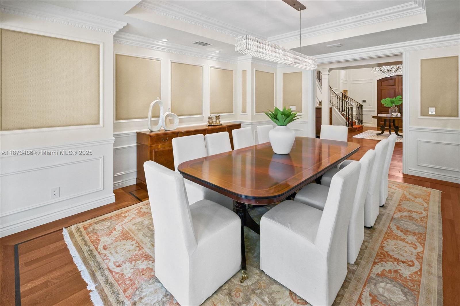 5400 Banyan Trail Coral Gables, FL 33156 - Photo 23 of 75 a dining room with furniture and wooden floor