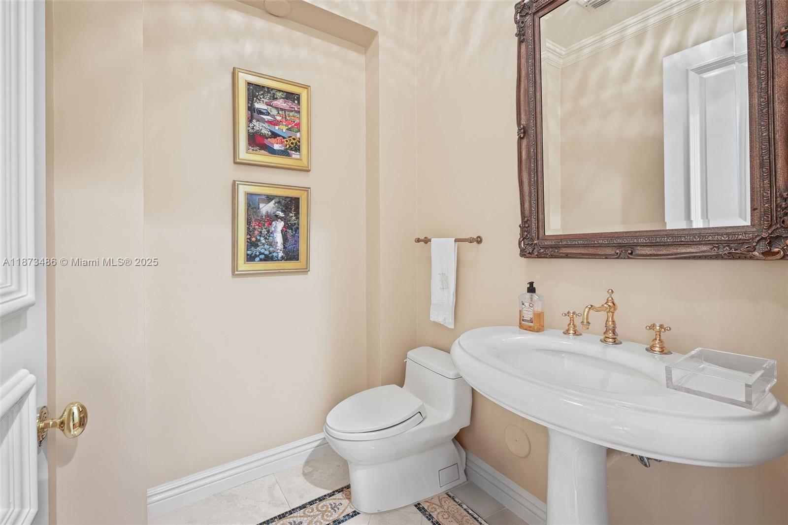 5400 Banyan Trail Coral Gables, FL 33156 - Photo 26 of 75 a bathroom with a sink and a toilet