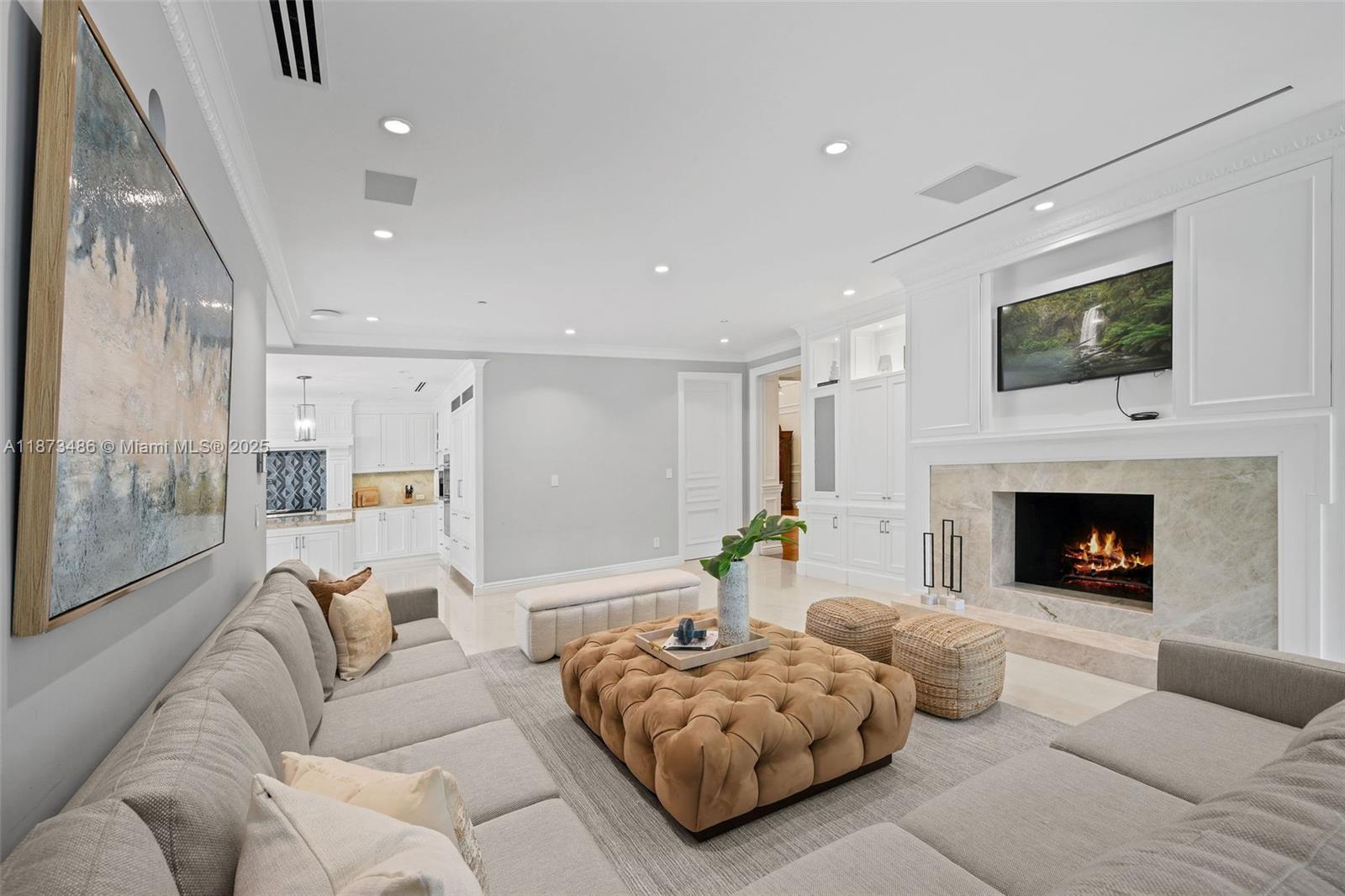 5400 Banyan Trail Coral Gables, FL 33156 - Photo 27 of 75 a living room with furniture and a fireplace
