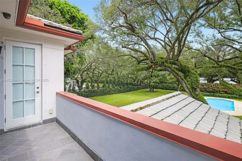 a view of a park with large trees