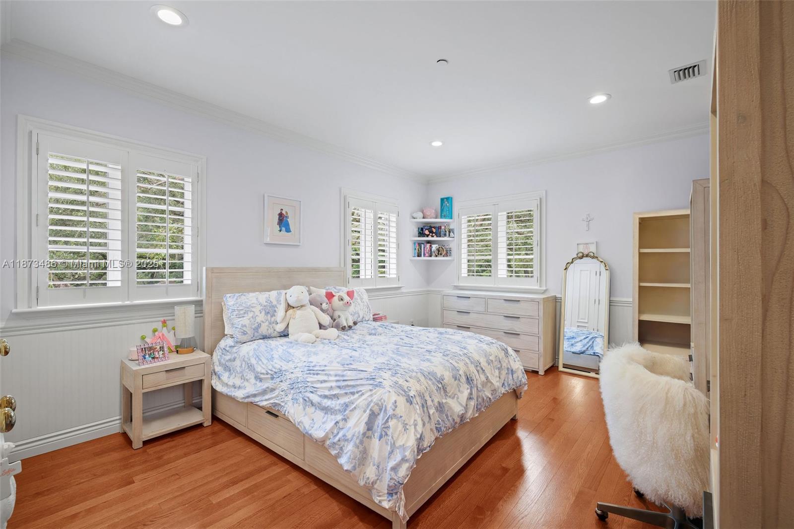 5400 Banyan Trail Coral Gables, FL 33156 - Photo 50 of 75 a bedroom with a bed and a table in it next to a window