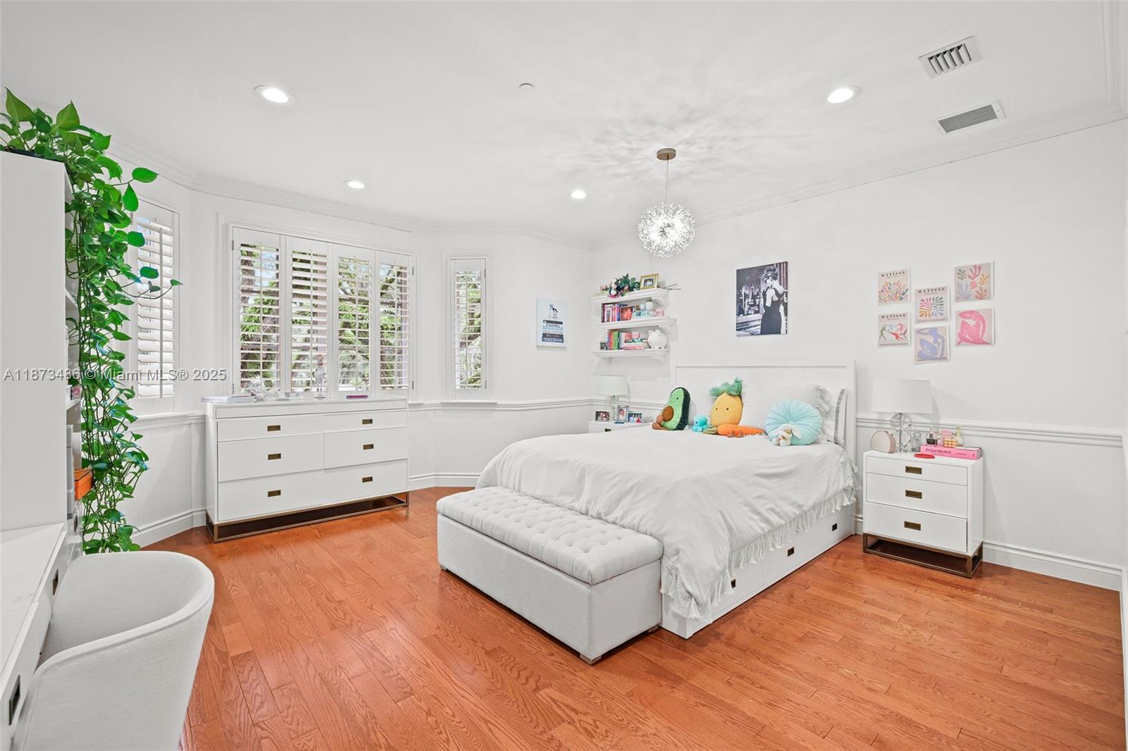 5400 Banyan Trail Coral Gables, FL 33156 - Photo 52 of 75 a bedroom with a bed and a couch