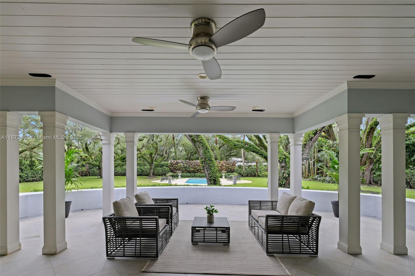 5400 Banyan Trail Coral Gables, FL 33156 - Photo 8 of 75 a living room with patio