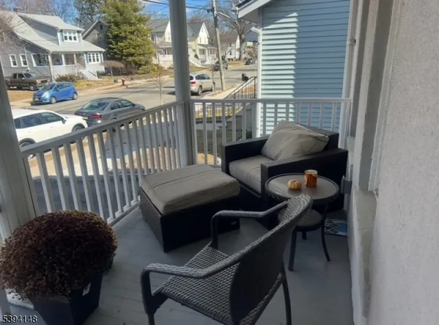a view of a balcony with chairs
