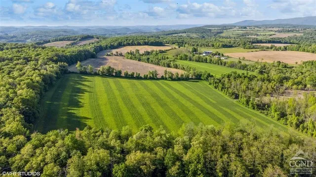 a view of lake with green space