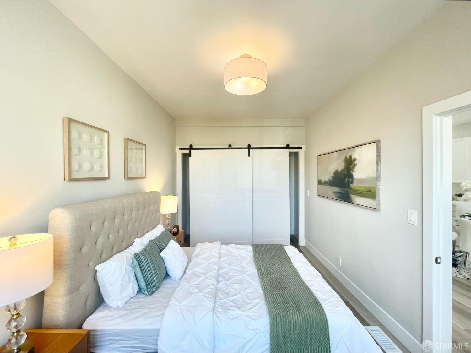 37 Ruth Street San Francisco, CA 94112 - Photo 12 of 26 a bedroom with a bed and a couch