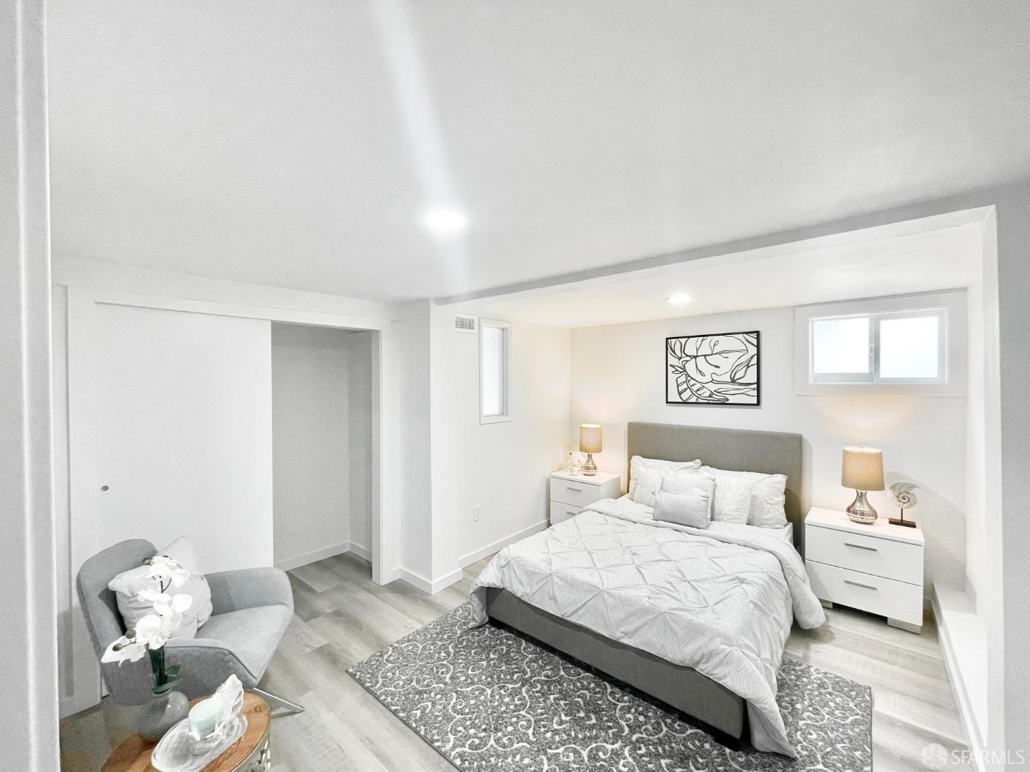 37 Ruth Street San Francisco, CA 94112 - Photo 18 of 26 a bedroom with a bed and wooden floor