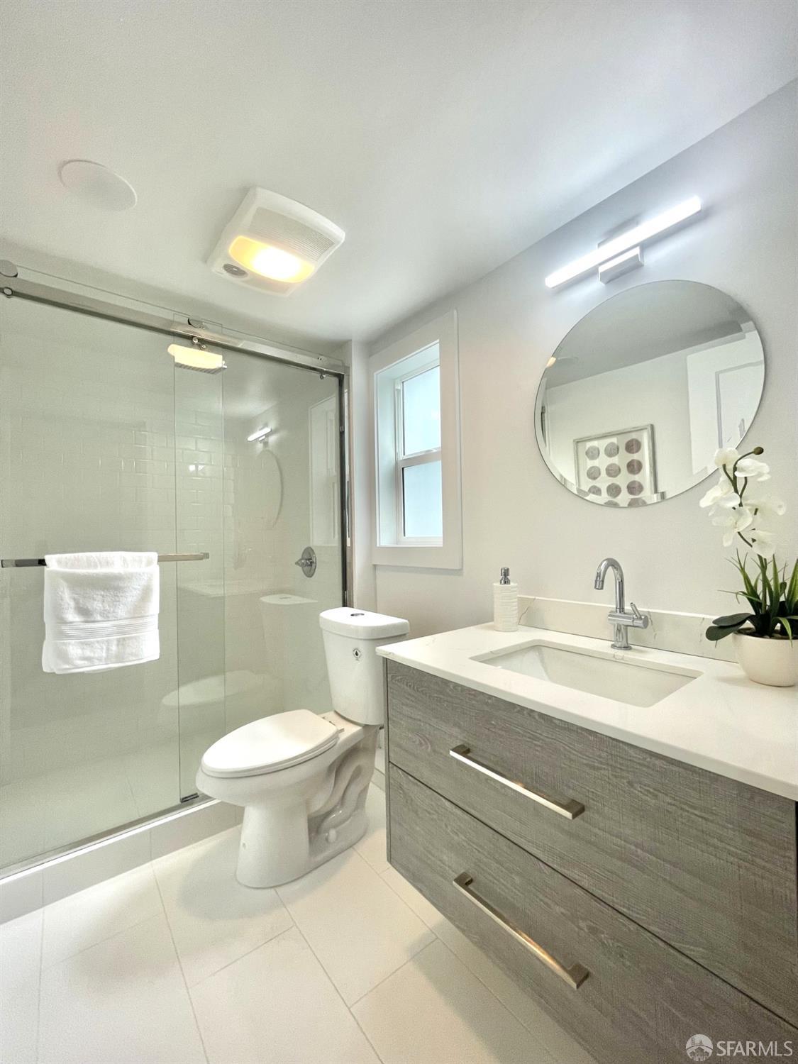 37 Ruth Street San Francisco, CA 94112 - Photo 19 of 26 a bathroom with a sink a toilet and a mirror
