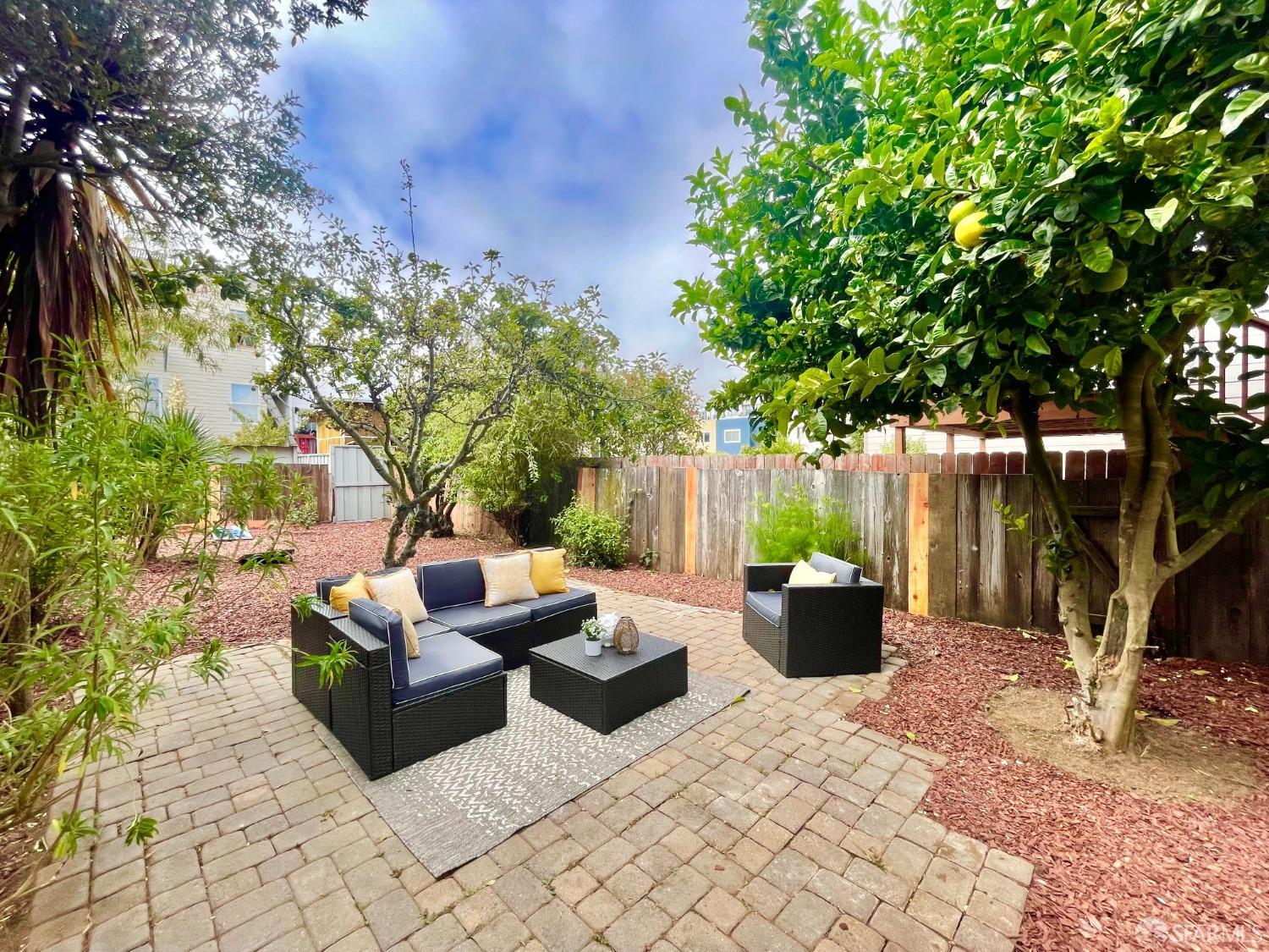 37 Ruth Street San Francisco, CA 94112 - Photo 21 of 26 a view of a couches in the patio with a fire pit