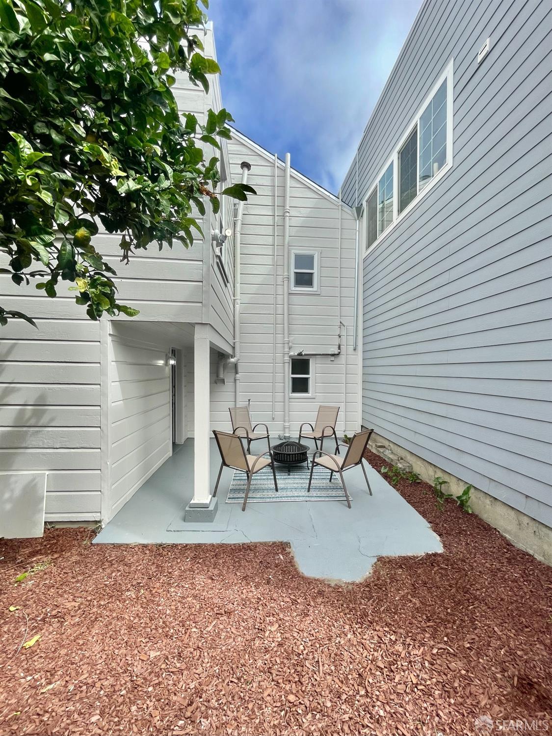37 Ruth Street San Francisco, CA 94112 - Photo 23 of 26 a backyard of a house with outdoor seating