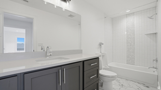 1682 North 1950 W Street, Unit 9 Provo, UT 84604 - Photo 61 of 84 Bathroom featuring a gray vanity with a single under-mount sink, white countertop, and a large wall-mounted mirror
