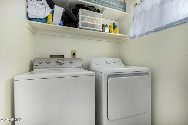 a utility room with dryer and washer