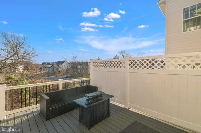 a view of a city with tall buildings and a cars parked in front of it