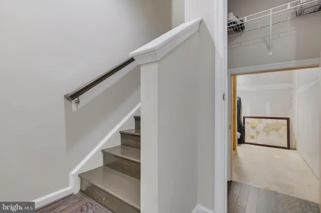 a living room with furniture a large window
