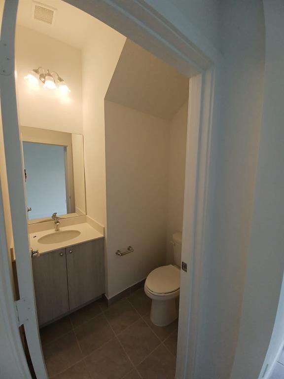 Undisclosed Address Immokalee, FL 34142 - Photo 8 of 30 a bathroom with a toilet sink and mirror