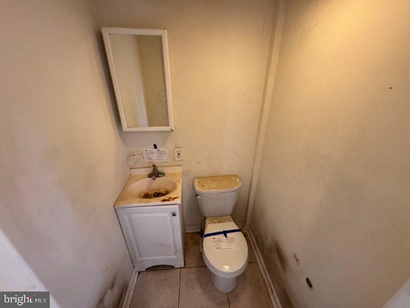 338 Springfield Road Aldan, PA 19018 - Photo 14 of 18 a white toilet sitting next to a bathroom sink