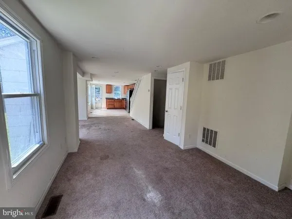 a view of a livingroom with a staircase