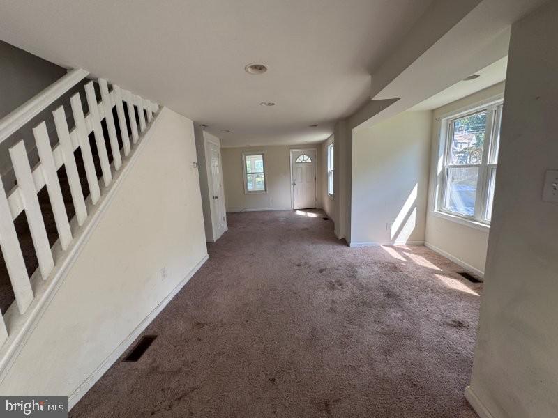 338 Springfield Road Aldan, PA 19018 - Photo 7 of 18 a view of a livingroom with wooden floor and stairs