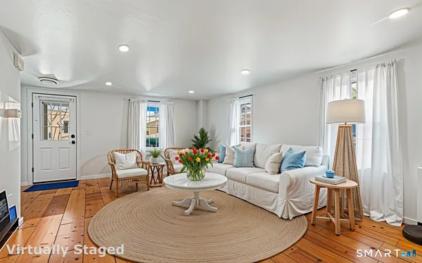 a living room with furniture and a table