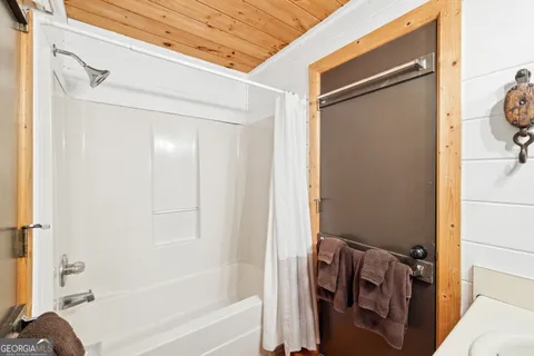 a view of balcony with wooden floor and outdoor seating