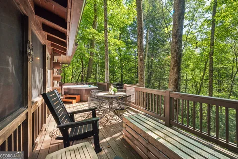 a view of a chair and tables in the balcony