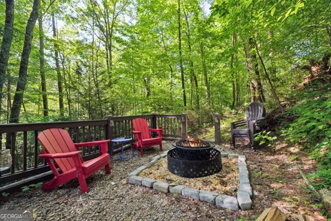 a view of balcony with two chairs and a table