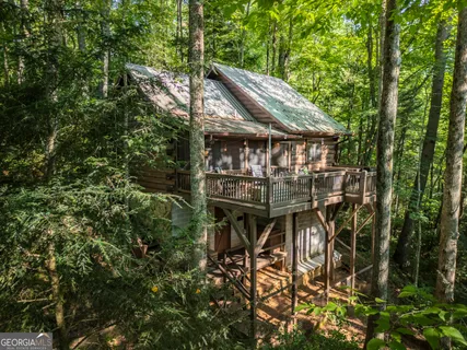 a view of a house with a tree