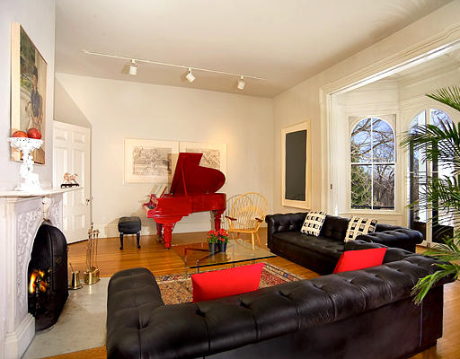 180 Moss Hill Road Boston, MA 02130 - Photo 4 of 9 a living room with furniture and a fireplace