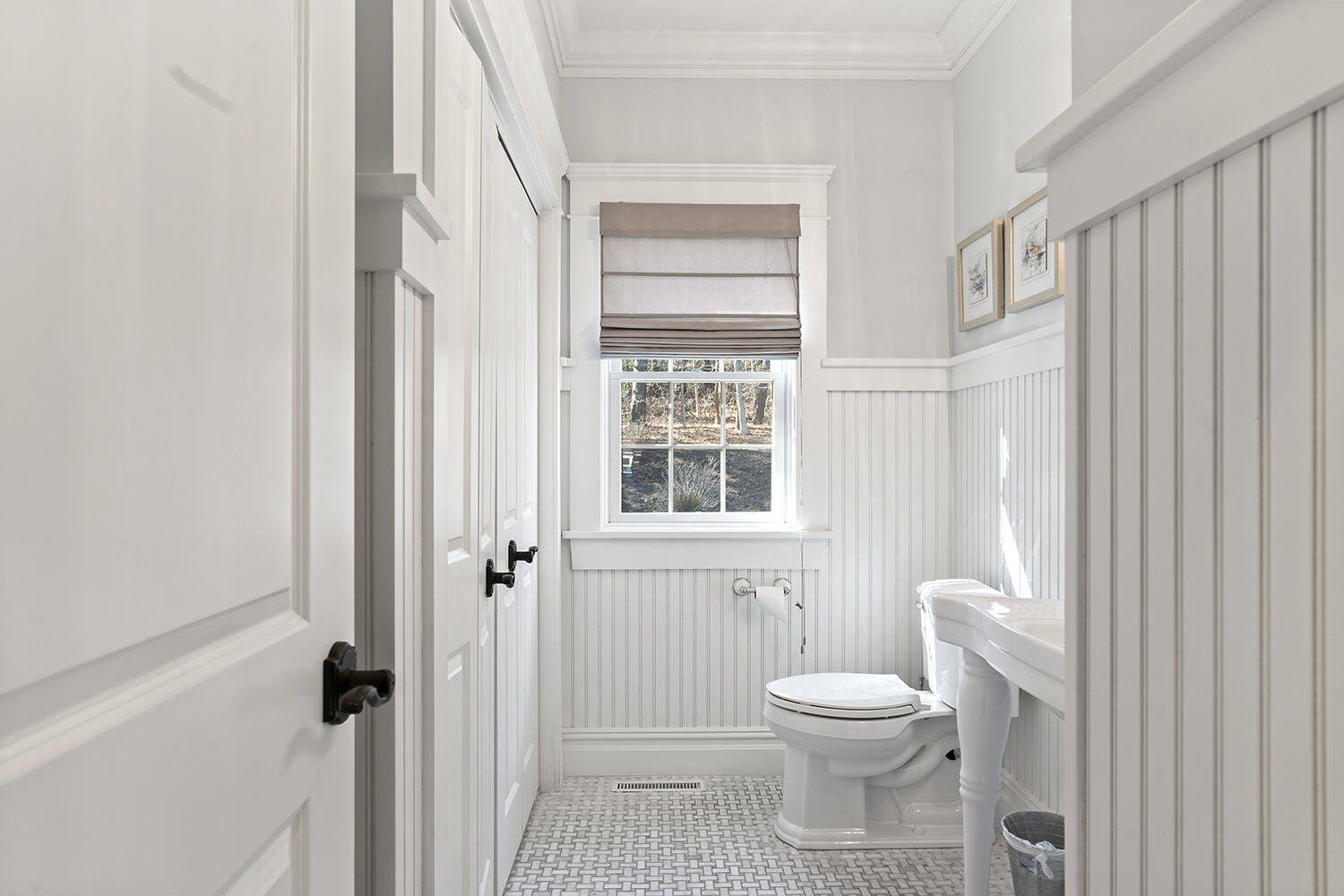 16 Mockingbird Drive Edgartown, MA 02539 - Photo 18 of 36 a bathroom with a toilet a sink and a window