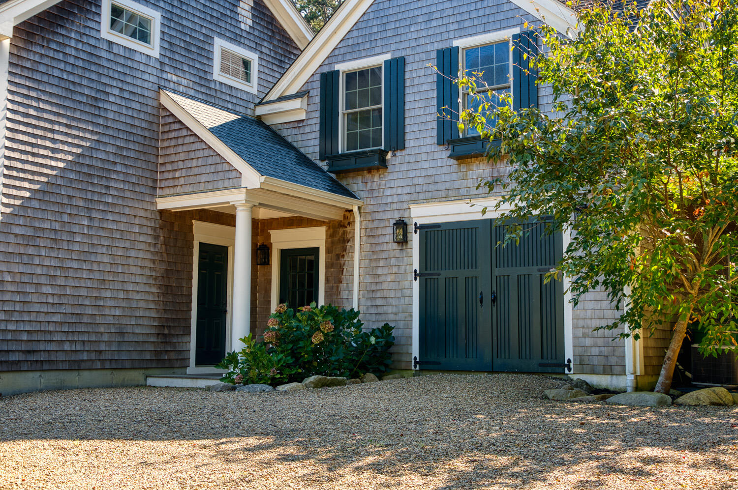 16 Mockingbird Drive Edgartown, MA 02539 - Photo 3 of 36 a view of a house with a yard and potted plants
