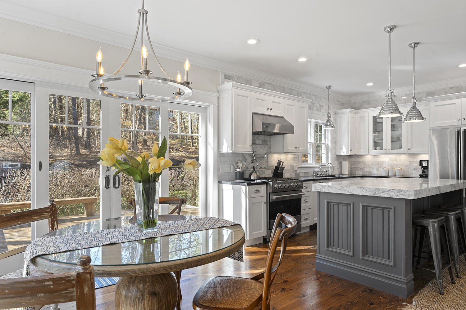 16 Mockingbird Drive Edgartown, MA 02539 - Photo 8 of 36 a kitchen with sink table and chairs