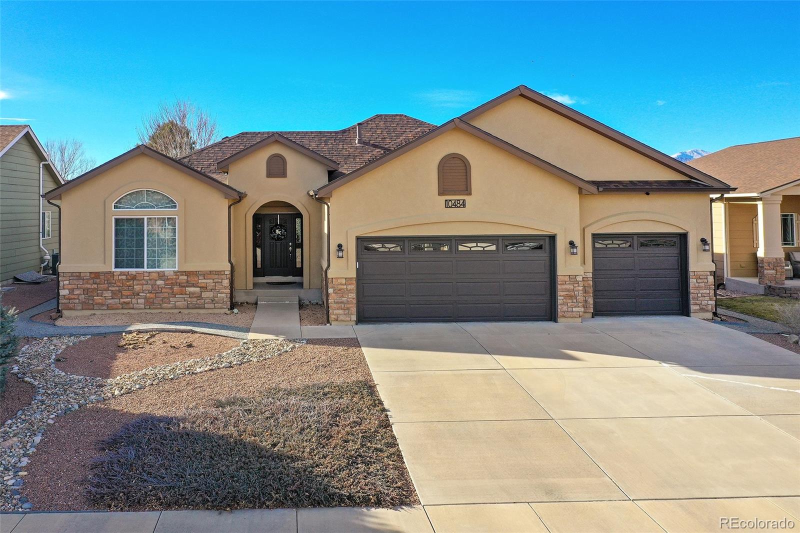 10484 Mile Post Loop Fountain, CO 80817 - Photo 1 of 50 a front view of a house with a yard and garage